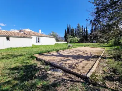 a concrete pad in the middle of a yard at Les copains d'abord ! in Lacoste