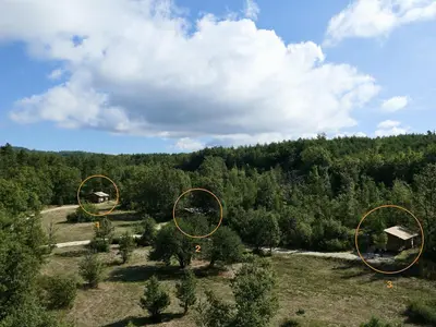 an overhead view of a field with trees in the background at La Grisonne - Gîte Camus in Revest-du-Bion