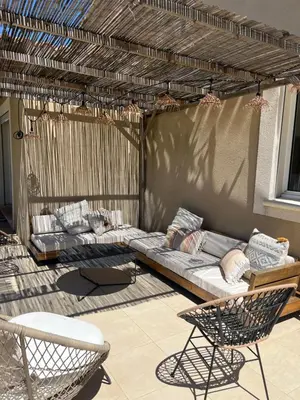 a living room with a couch and a table and chairs at Magnifique villa familiale avec piscine in Caumont-sur-Durance