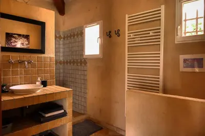 a bathroom with a sink and a window at Villa jeanne avec piscine Chauffée à Bedoin in Bédoin