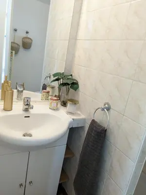a bathroom with a white sink and a mirror at La Port-Gentillaise in Aix-en-Provence