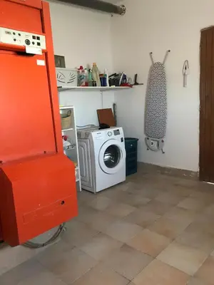 a kitchen with a washing machine and a washer at Maison au pied du mont ventoux in Carpentras