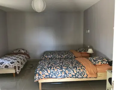 a bedroom with two beds in a room at Maison au pied du mont ventoux in Carpentras