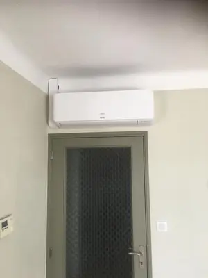 a bathroom mirror with a air conditioner on the ceiling at Les Juliens in Gordes