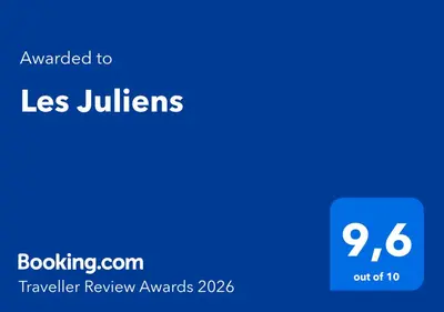 a blue screen with the text awarded to less junitors at Les Juliens in Gordes