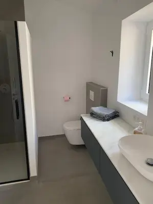 a bathroom with a toilet and a sink at Magnifique Mas avec Piscine Luberon (Gordes) in Murs