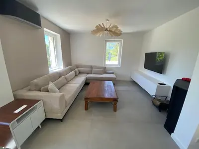 a living room with a couch and a coffee table at Magnifique Mas avec Piscine Luberon (Gordes) in Murs