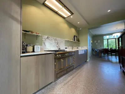 a kitchen with a stove and a counter top at La palasse in Le Thor