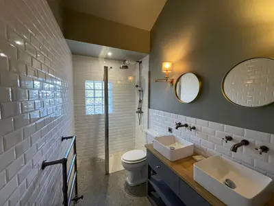 a bathroom with a sink and a toilet and a mirror at La palasse in Le Thor