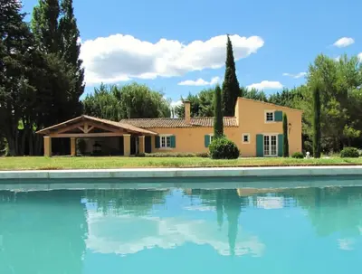 a house and a swimming pool in front of a house at LUBERON - AIR CONDITIONING VILLA - 4 BEDROOMS - 4 BATHROOM in Lourmarin
