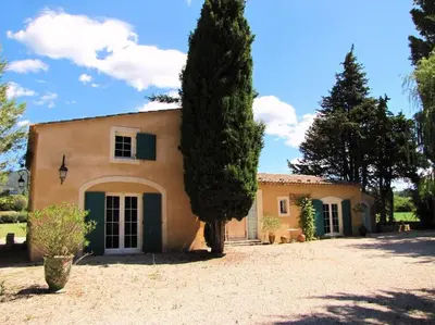 a house with a tree in front of it at LUBERON - AIR CONDITIONING VILLA - 4 BEDROOMS - 4 BATHROOM in Lourmarin