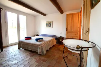 a bedroom with a bed and a tub in it at LUBERON - AIR CONDITIONING VILLA - 4 BEDROOMS - 4 BATHROOM in Lourmarin