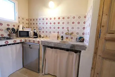 a kitchen with a sink and a counter top at Provencal farm with heated pool in Lamanon near Aix en Provence - 12 people in Lamanon