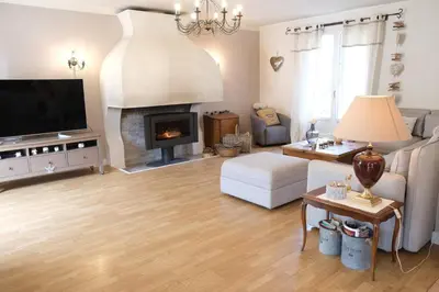 a living room with a couch and a fireplace at Typical farm with private pool close to the Ventoux 8 persons in Althen-des-Paluds