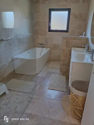 a bathroom with a tub and a sink at Maison Neuf en Provence in Monteux