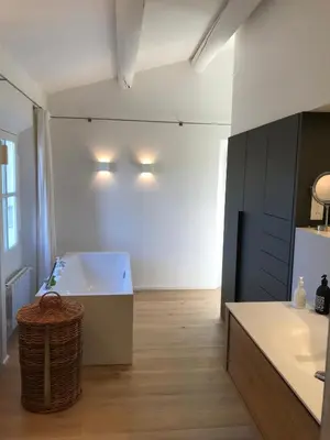 a white staircase with pictures on the wall at Mas provencal XIXème siécle avec piscine in Aix-en-Provence