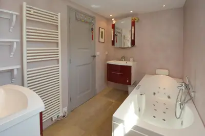 a bathroom with a tub and a toilet and a sink at St REMY AILLEURS in Noves