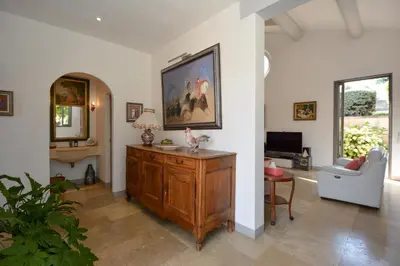 a living room with a large painting on the wall at St REMY AILLEURS in Noves