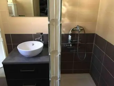 a bathroom with a sink and a shower at Villa provençale entre Aix en Provence et Luberon in Rognes
