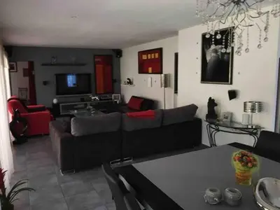a living room with a couch and a table at Villa provençale entre Aix en Provence et Luberon in Rognes