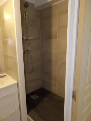 a walk in shower in a bathroom with a shower at Studio chez Steph in Eyguières