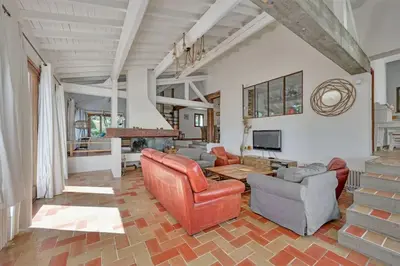 a living room filled with furniture and a fireplace at Grande villa avec piscine près d'Avignon - Jonquerettes in Jonquerettes