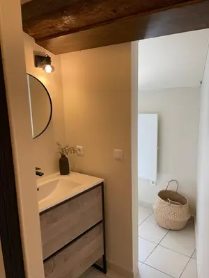 a bathroom with a sink and a mirror at UN DOUX MOMENT in Pernes-les-Fontaines