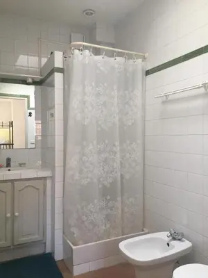 a bathroom with a shower curtain and a sink at Aix center in Aix-en-Provence