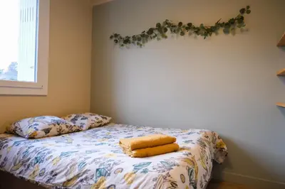 a bedroom with a bed with two towels on it at Appartement 2 Queenbed parking clim wifi in Aix-en-Provence