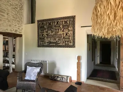 a living room with a picture hanging on the wall at Clos de l'Abba in Gordes