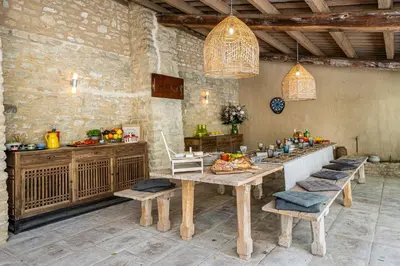 a dining room with a table and some chairs at Vue Dexception Gordes in Gordes