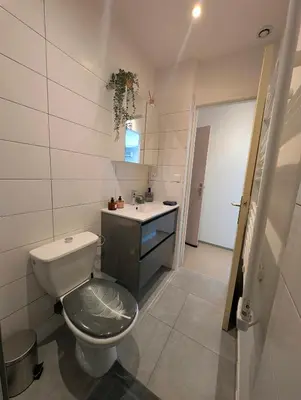 a bathroom with a toilet and a sink at L'instant sorgue in LʼIsle-sur-la-Sorgue