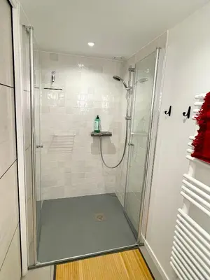 a shower with a glass door in a bathroom at Au calme dans la campagne Aixoise, entouré de cyprès in Aix-en-Provence
