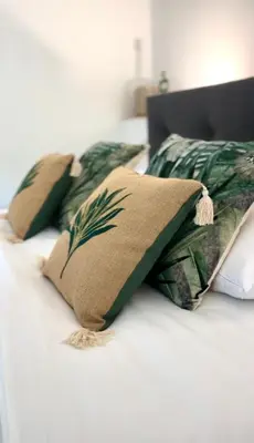 two pillows sitting on top of a bed at Villa du Tallagard in Salon-de-Provence
