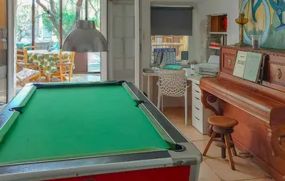 a pool table in a room with a piano at 3 Bedroom Awesome Home In Carpentras in Carpentras