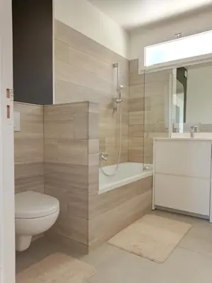 a bathroom with a toilet and a shower and a sink at Villa Lambesc Provence in Lambesc