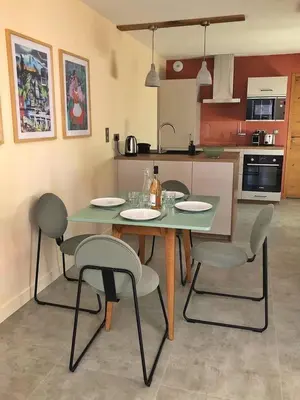 a table and chairs in a kitchen with a table and chairsktop at L'Oustalet des Alpilles in Saint-Rémy-de-Provence