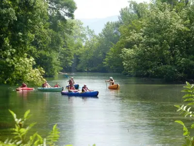 a group of people kayaking down a river at Holiday Home in Villes-sur-Auzon with Pool in Villes-sur-Auzon