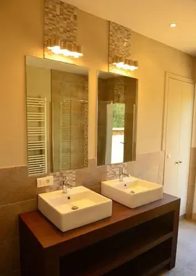 a bathroom with two sinks and a large mirror at Villa au calme et sans vis à vis , proche du village in La Bastide-des-Jourdans