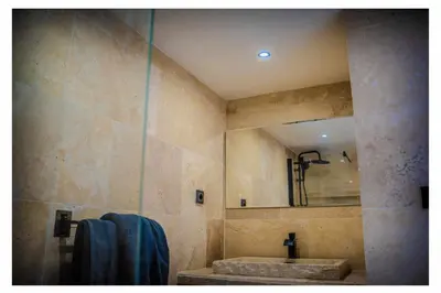 a bathroom with a sink and a mirror at La Bella Vista in Villelaure