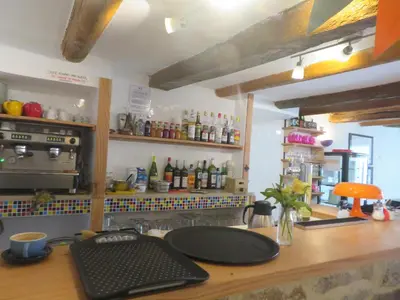 a kitchen with a counter with a stove and a counter top at Auberge de la petite casserole in Revest-des-Brousses