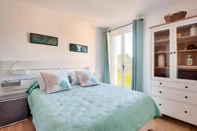 a bedroom with a bed with two pillows and a window at Les Mas et Villas de Pont Royal en Provence - maeva Home - Villa duplex moderne et vintage 3 pièces 6 personnes climatisée - Prestige - super Home MAE-4211 in Mallemort