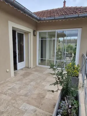 a patio of a house with a door and windows at La Villa Jasmin - RENDEZ-VOUS EN PROVENCE in Monteux