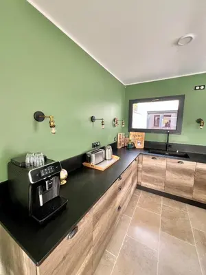 a kitchen with a counter with a coffee maker on it at La Villa de Jéna in Mazan