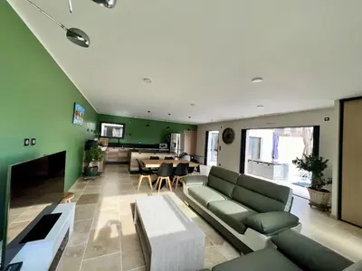 a living room with a couch and a table at La Villa de Jéna in Mazan