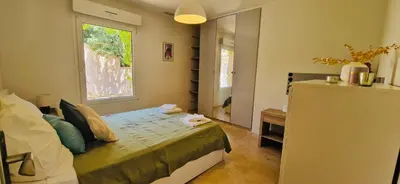 a small bedroom with a bed and a window at La Maison du Soleil in Saint-Didier