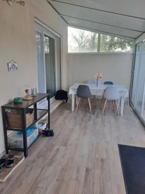 a room with a table and chairs and a dining room at Jolie petite maison tout proche d avignon in Vedène