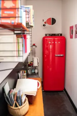 a red refrigerator in a room with a desk at Maison Jalon in Aix-en-Provence