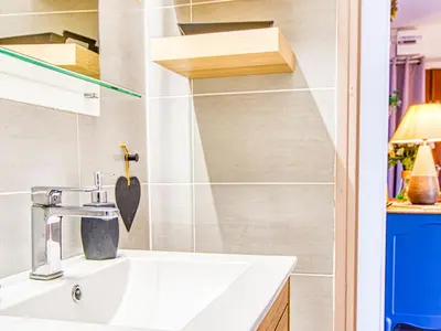 a bathroom with a sink and a mirror at Apartment Chez Lucie by Interhome in Aix-en-Provence