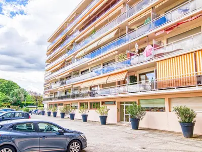 a building with cars parked in front of it at Apartment Chez Lucie by Interhome in Aix-en-Provence